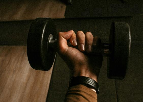 hand-holding-dumbbell-strength-training